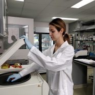 Alexandra Malinowski loads the centrifuge.