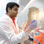 Dr. Mrinal Pal collects cell culture for RNA extraction.